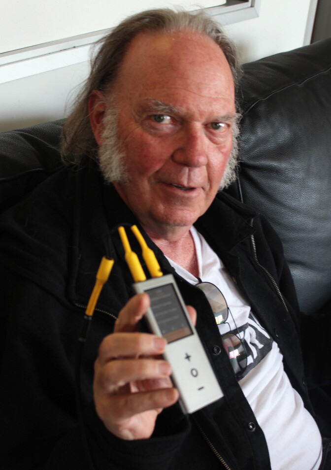 Neil Young and his Pono, a high-resolution audio player that sells for $399.
