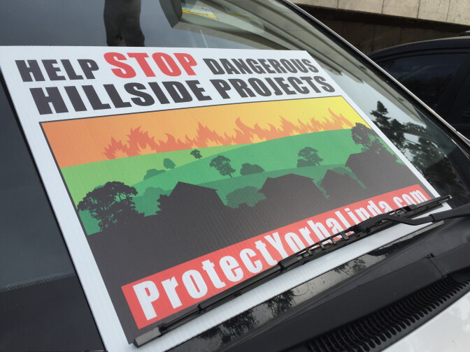 Yorba Linda residents are protesting a proposed 340-single family home development slated just north of the city because of fears existing roads wouldn't be able to handle increased traffic during a wildfire evacuation. 