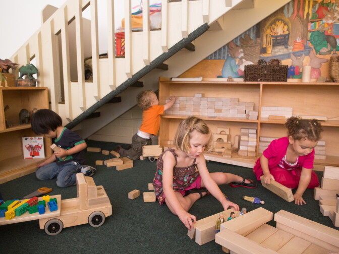 Girls and boys play with blocks at the Child Educational Center in La Cañada.