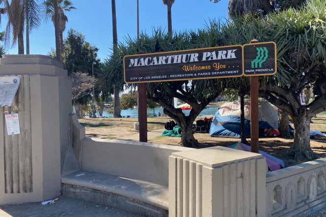 The entry sign to the lakeside portion of MacArthur Park along with tents.