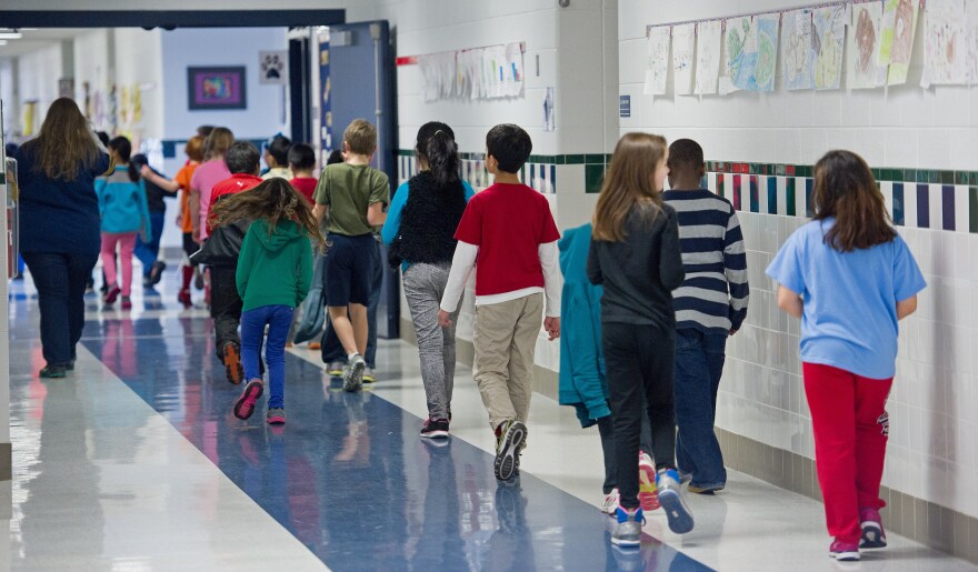 Students walking the hallways are seen February 21, 2014, at Steuart W. Weller Elementary School in Ashburn, Virginia.