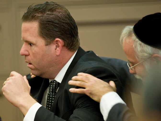 Former Fullerton police Officer Jay Cicinelli was  acquitted of involuntary manslaughter and assault under color of authority for his role in the July 5, 2011, beating of transient Kelly Thomas. He put his head in his hands and kept his head down immediately after hearing he would walk free. 
POOL PHOTO, MINDY SCHAUER, ORANGE COUNTY REGISTER