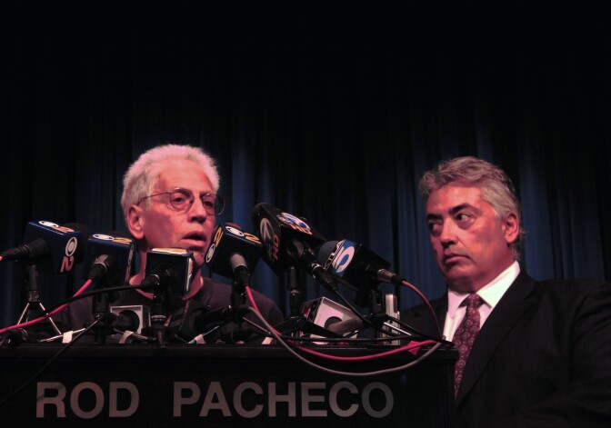 Joseph Bonaminio (left), the father of slain Riverside policeman Ryan Bonaminio, and Riverside County District Attorney Rod Pacheco announce the charges against suspected killer Earl Ellis Green at a Tuesday news conference. 