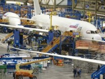 Boeing employees work on a Boeing 787 Dreamliner on one of the assembly lines February 14, 2011 at the company's factory in Everett, Washington. The Commerce Department said Wednesday that orders for long-lasting U.S. factory goods fell sharply last month, dragged lower by a steep drop in volatile commercial aircraft demand. But orders that reflect business investment plans rose slightly.
