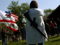 Gun rights groups gather at Fort Hunt Park for an 'Open Carry Rally' on April 19, 2010 in Alexandria, Va. The groups gathered in a National Park area to publicly carry weapons as a demonstration of their constitutional rights to bear arms.
