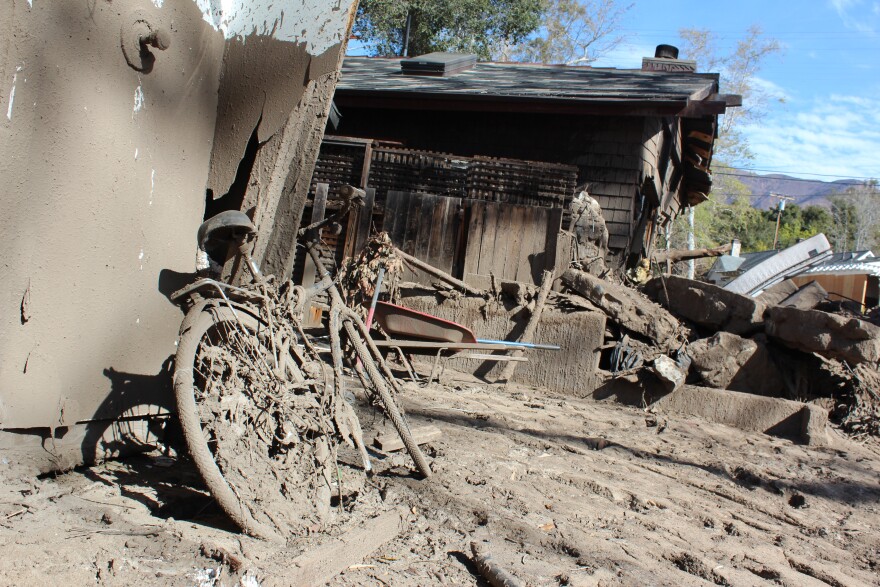 A bike caked in mud stands in the wreckage of a debris flow in Montecito on Thurs., March 8, 2018.