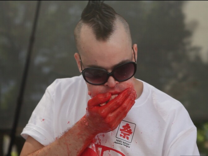 Pat "Deep Dish" Bertoletti during a competitive eating competition in a still from documentary "Hungry."