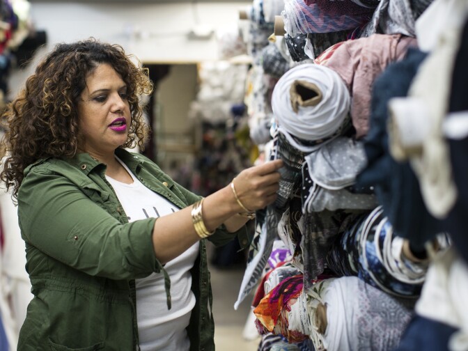 Sonia Smith-Kang looks through fabric on Wednesday afternoon, Feb. 10, 2016 at Rag Finders of California, a wholesale fabric store where she sources her materials.