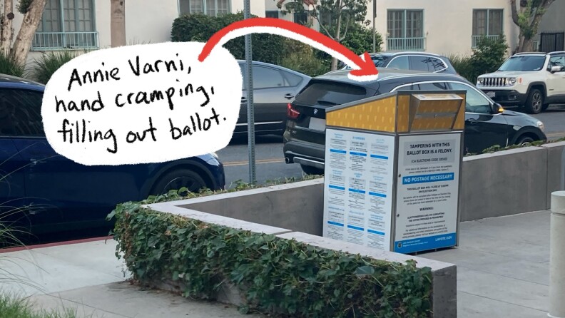 Several cars sit on a street behind a orange, white, and blue election ballot box. An arrow and text bubble points to a vehicle. The text reads "Annie Varni, hand cramping, filling out ballot"
