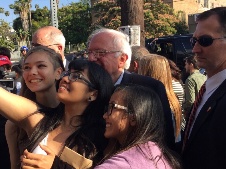 Presidential candidate Bernie Sanders poses for pictures with fans in Silver Lake.