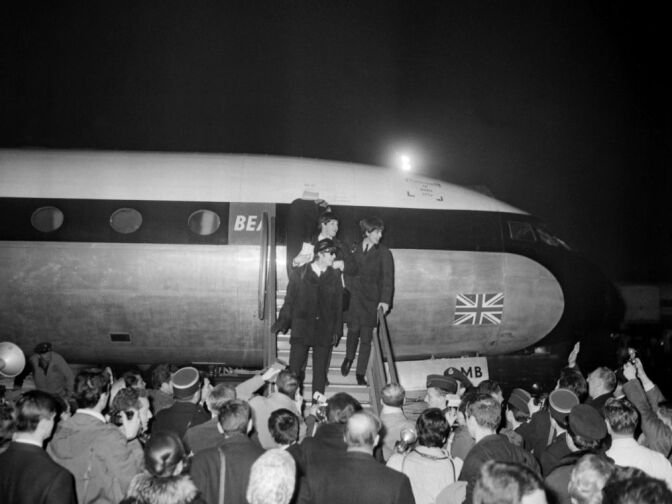 The Beatles arrive 15 January 1964 in France at the Bourget airport near Paris, to perform their first series of concerts outside of Britain.  