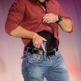 A model walks the runway during the NRA Concealed Carry Fashion Show on Friday, August 25, 2017 in Milwaukee, Wisconsin.  / AFP PHOTO / Joshua Lott        (Photo credit should read JOSHUA LOTT/AFP/Getty Images)