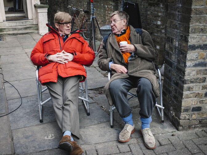 Playwright Alan Bennett (right) sits with actor Alex Jennings on the set of <em>The Lady in the Van</em>. Bennett's plays include <em>The Madness of George III</em> and <em>The History Boys</em>.