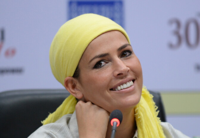 Former Miss World Linor Abargil of Israel looks on during a function to celebrate International Women's Day in New Delhi on March 10, 2014. Just six weeks prior to her participation in the Miss World contest 1998, Abargil was abducted, stabbed, and raped in Milan when she was 18 years old. Despite the excruciating trauma, she went on to win the Miss World contest in 1998.