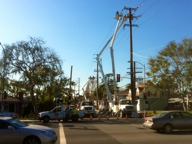 Southern California Edison workers trying to restore power at the intersection of Live Oak Avenue and Baldwin Avenue in Temple City following last year's windstorm. Edison says revenue from its 5.04 percent rate hike will pay for infrastructure upgrades needed after the storm.