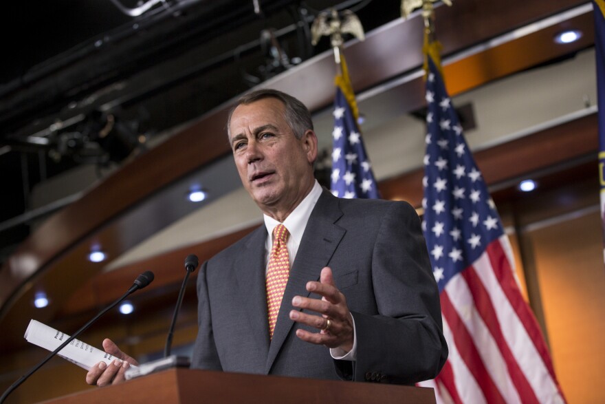 Speaker of the House John Boehner, R-Ohio, talks to reporters about the deadline to fund the government and the fight among House Republicans, on Capitol Hill in Washington, Sept. 19, 2013. House Republicans vowed Wednesday to pass legislation that would prevent a partial government shutdown and avoid a default while simultaneously canceling out President Barack Obama's health care overhaul, inaugurating a new round of political brinkmanship as critical deadlines approach.