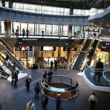 NEW YORK, NY - NOVEMBER 10:  Commuters walk through the newly opened Fulton Center train station in lower Manhattan on November 10, 2014 in New York City.  The station was scheduled to open in 2007 as part of the rebuilding effort of lower Manhattan after 9/11, but the project ran into cost overruns and years of delays. The original plan for the facility, which has a glass and steel shell and 66,000 square feet of retail and office space, was projected at $750 million and nearly doubled to $1.4 billion before it was finished. The station features a 10-foot-high glass opening , or oculus, which sits above an atrium that lets sunlight down into two levels below street level. The station makes it easier to connect between nine subway lines: the A, C, J, Z, R, 2, 3, 4, and 5. Riders will eventually also be able to connect to the E and 1 trains, as well as the PATH.  (Photo by Spencer Platt/Getty Images)