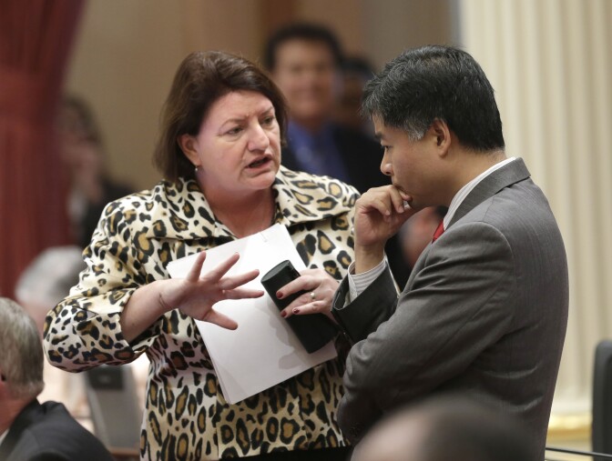 In this photo taken Sept. 3, 2013, Assemblywoman Toni Atkins, D-San Diego, talks with Sen. Ted Lieu, D-Torrance, at the Capitol in Sacramento, Calif.  Gov. Jerry Brown signed Atkins bill, AB154, that will allow Nurse practitioners, certified nurse midwives and physician assistants in California to perform a type of early abortion, Wednesday, Oct, 9, 2013. (AP Photo/Rich Pedroncelli)