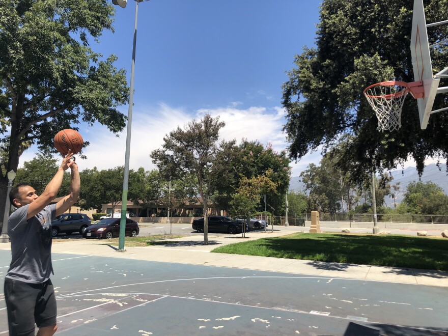 Raymond Pecson takes a shot at a park in East Pasadena, where the air quality is unhealthy for sensitive groups.