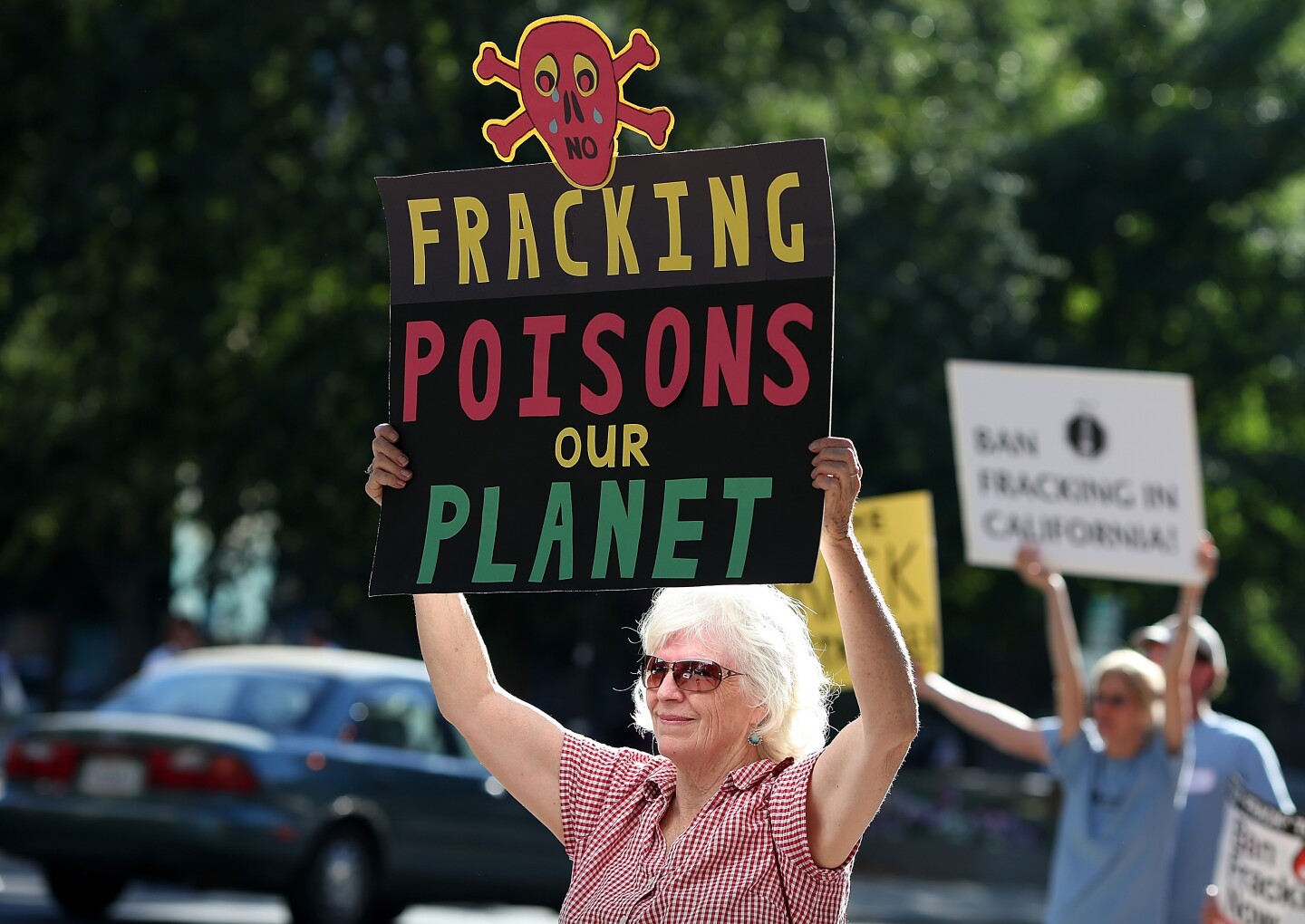 Protestors hold signs against fracking during a demonstration outside of the California Environmental Protection Agency (EPA) headquarters on July 25, 2012 in Sacramento, California. Dozens of environmental activists staged a "Stop Fracking With California" demonstration outside the California EPA headquarters ahead of public workshop hosted by the Division of Oil Gas and Geothermal Resources where protestors are planning to voice their opposition to the rushed regulatory of fracking and the many threats to the environment imposed by the process of hydraulic fracking for oil and gas.