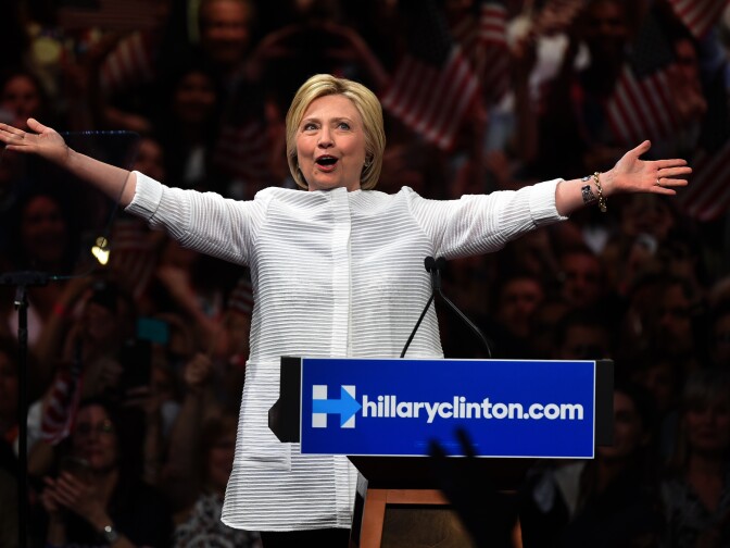 Democratic presidential candidate Hillary Clinton acknowledges celebratory cheers from the crowd during her primary night event at the Duggal Greenhouse, Brooklyn Navy Yard, June 7, 2016 in New York. 