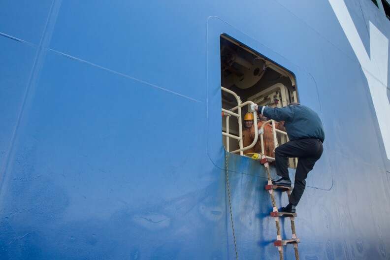 Port Pilot Brett Mc Daniel boards the Hyundai Faith ship. 