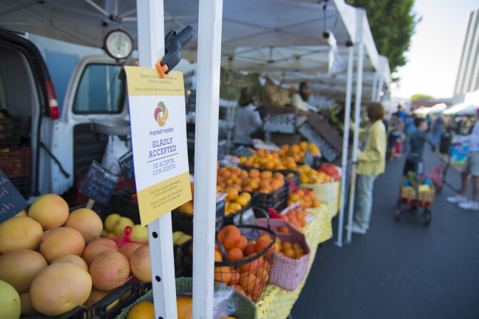 A flyer at the Hollywood Farmers Market advertises the Market Match program, which provides extra money to some EBT shoppers.