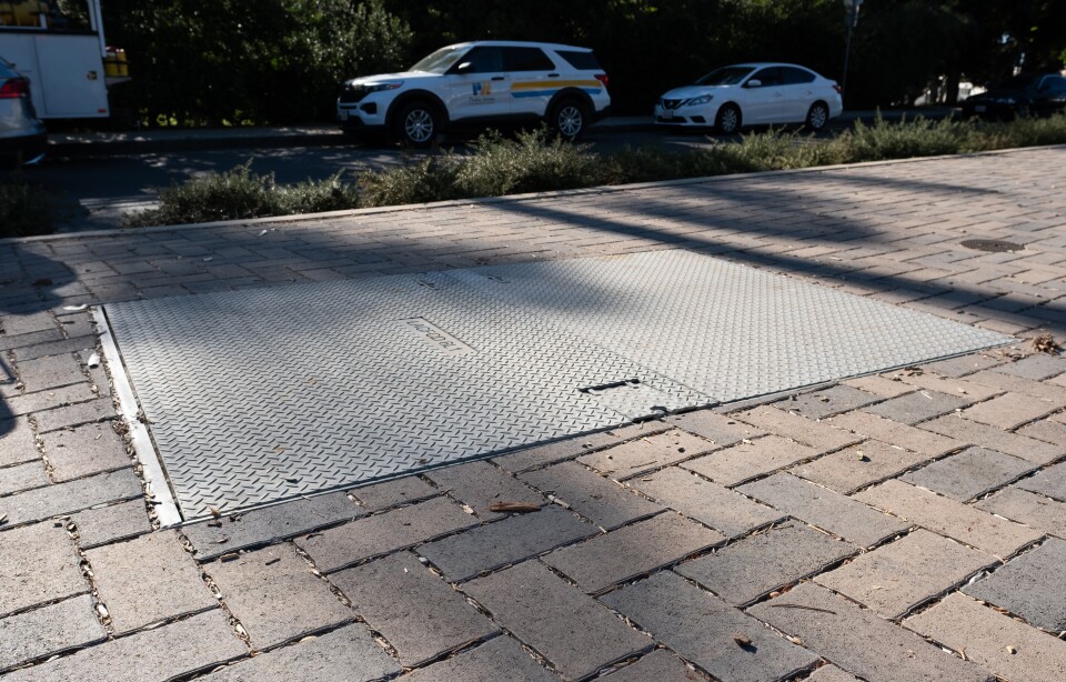 Sheets of metal on the sidewalk.