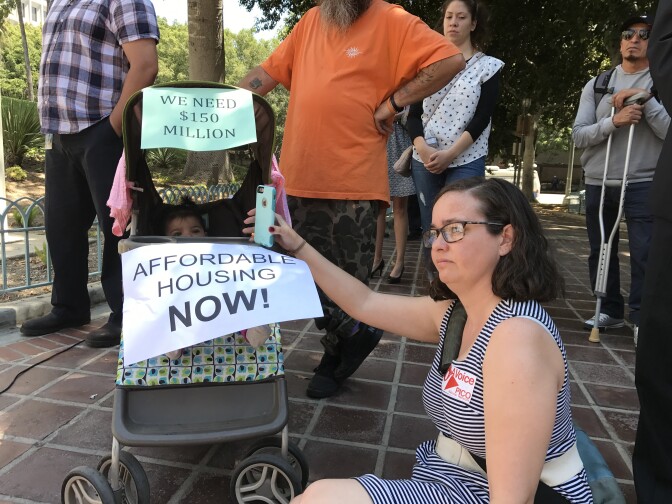 Supporters of a proposed linkage fee rally outside Los Angeles City Hall before a hearing in front of the council's planning panel.