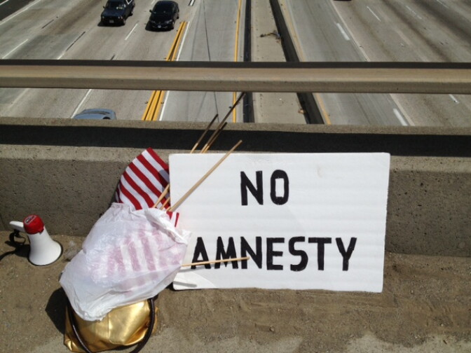 A sign belonging to volunteer members of We The People California's Crusader.