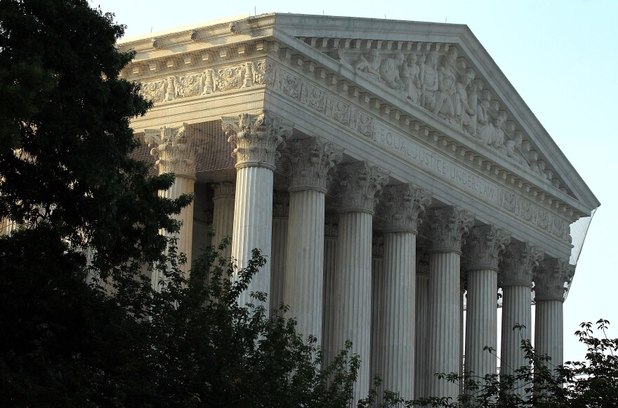 WASHINGTON, DC - JUNE 21:  An exterior view of the U.S. Supreme Court on June 21, 2012 in Washington, DC. The Supreme Court is expected to hand down its ruling on the Healthcare Reform Law before the end of its 2011-2012 term.  (Photo by Alex Wong/Getty Images)