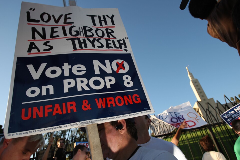 LOS ANGELES, CA - NOVEMBER 6:  Supporters of same-sex marriage protest near the Los Angeles Mormon Temple, seen in the distance, before marching for miles in protest against the Church of Jesus Christ of Latter-day Saints November 6, 2008 in Los Angeles, California. The protest, which began outside the Los Angeles Mormon temple, opposes massive financial contributions to the Proposition 8 campaign, which voters passed and which changes the California Constitution to make gay marriage illegal. When same-sex marriages became legal in California on June 16, conservative churches vowed to fight it and successfully passed Proposition 8 with funds that dwarfed that of their opponents. Demonstrators say the Mormon Church contributed some $35 million to pass the measure.  (Photo by David McNew/Getty Images)