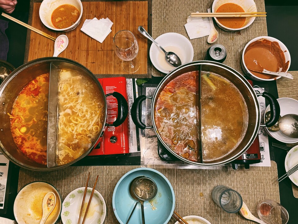 A table full of Chinese food dishes.