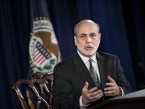  Federal Reserve policymakers are divided over when to end extraordinary measures intended to encourage more borrowing and spending to help stimulate the U.S. economy, according to minutes of the Fed's last meeting released Wednesday. (Chairman of the Federal Reserve Ben Bernake speaks during a news briefing at the Federal Reserve 11, 2012 in Washington, DC.)   