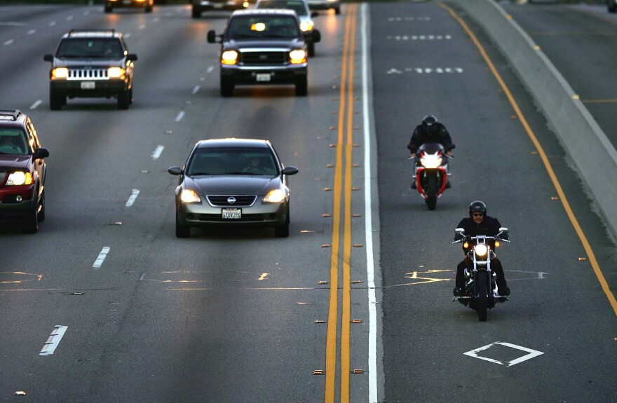 Two motorcyclists drive in the High Occupancy Vehicle (HOV) lane, also called the diamond or commuter lane, on the 118 or Ronald Reagan Freeway on February 3, 2005 near Simi Valley, California.