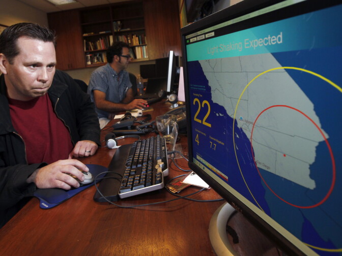 FILE - In this Sept. 13, 2011 file photo, Anthony Guarino Jr., a seismic analyst at the California Institute of Technology, demonstrates an early earthquake warning system in Pasadena, Calif. California state Sen. Alex Padilla is holding a hearing Wednesday, Oct. 15, 2014, at San Francisco City Hall to get an update from the director of the Governor's Office of Emergency Services about plans for a comprehensive statewide earthquake early warning system.  (AP Photo/Reed Saxon, File)