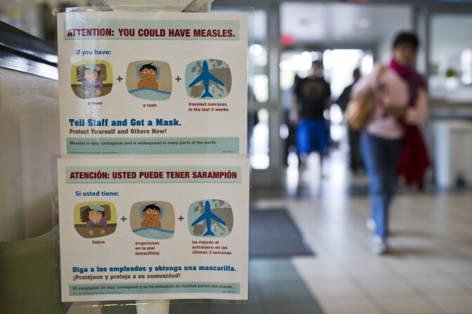 Posters list measles symptoms at the entry points of Olive View UCLA Medical Center in Sylmar on Monday, Jan. 26. The hospital has posted the signs after the recent measles outbreak in Southern California.