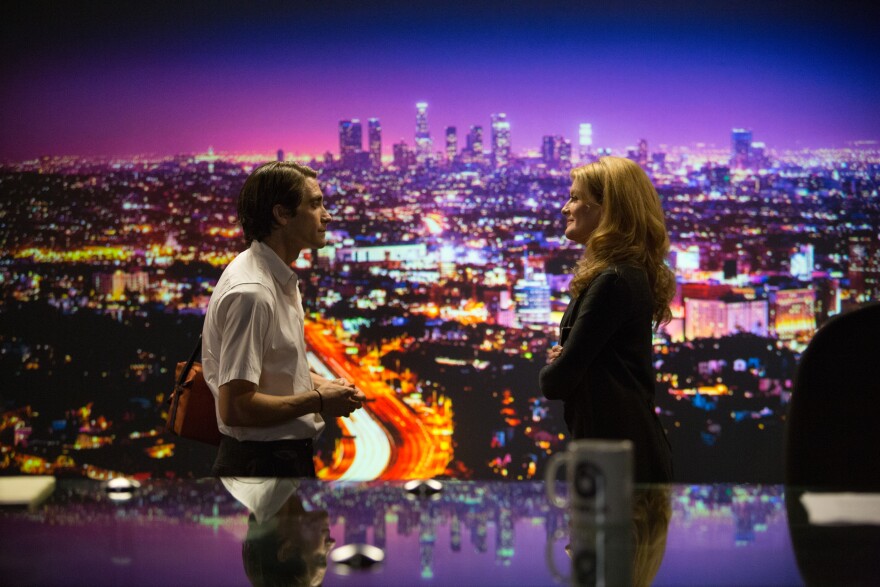 (Left to right) Jake Gyllenhaal as Lou Bloom and Rene Russo as Nina Romina in "Nightcrawler," written and directed by Dan Gilroy, opening October 31, 2014.