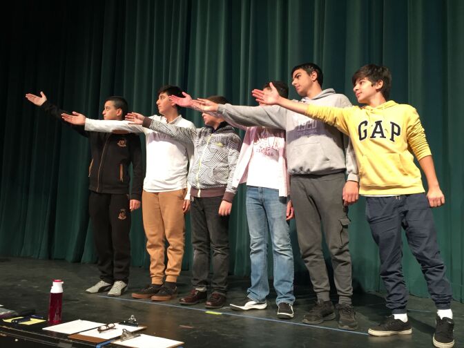 Students in the English Language Development class at John Muir Middle School rehearse for a poetry performance.