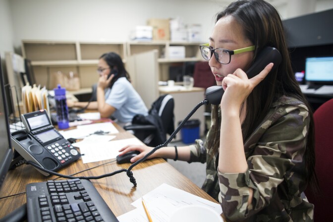 Yvonne Cui, a senior at San Gabriel High School, makes a call in Mandarin during a phone bank shift reminding people to vote in the upcoming primary election at the Asian Americans Advancing Justice Los Angeles on Monday evening, May 23, 2016. The center makes phone bank calls in 10 different languages.
