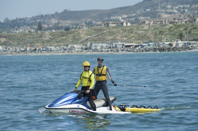 Dr. Chris Lowe of California State University, Long Beach, joins a San Clemente life guard on a jet ski while looking for sharks during a research project on shark behavior near the San Clemente pier, Tuesday June 28, 2017.
