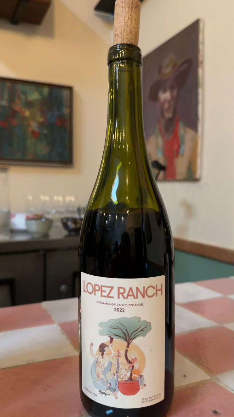A bottle of wine with the words "Lopez Ranch" on the label. 