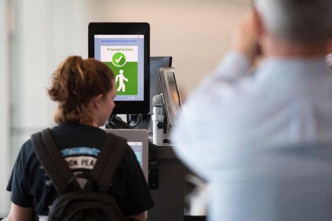 A woman boarding a SAS flight to Copenhagen goes through facial recognition verification system VeriScan at Dulles International Airport in Dulles, Virginia, on September 6, 2018. (Photo by Jim WATSON / AFP)        (Photo credit should read JIM WATSON/AFP/Getty Images)