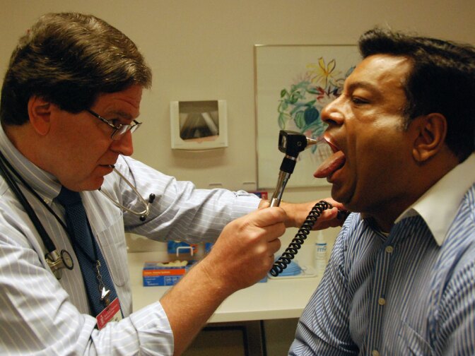 Dr. Howard Libman of Beth Israel Deaconess Medical Center in Boston conducts a routine exam of his long-term patient, Amit Dixit, a software engineer. Libman said he thinks information should be accessible, but worries it will mean more work for doctors who may need to explain their notes to patients.