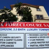 A bank foreclosure sale sign is posted in front of townhomes on August 12, 2010 in Los Angeles, California.