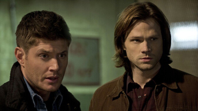 Dean Winchester (left, played by Jensen Ackles) and his brother Sam (Jared Padalecki) battle evil beings on CW's <em>Supernatural.</em> The brothers may be easy on the eyes, but sex appeal alone doesn't explain <em>Supernatural</em>'s passionate fan base.