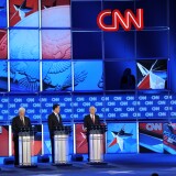 Republican presidential candidates takes questions from CNN moderator Wolf Blitzer (extreme right) during the Florida Republican Presidential debate January 26, 2012 at the University of North Florida in Jacksonville, Florida. From left are: former senator Rick Santorum; former House Speaker Newt Gingrich; former Massachusetts governor Mitt Romney; and Texas Rep. Ron Paul.       AFP PHOTO /Paul J. RICHARDS (Photo credit should read PAUL J. RICHARDS/AFP/Getty Images)
