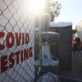 SAN FERNANDO, CALIFORNIA - DECEMBER 2: People walk to enter a COVID-19 testing site on December 2, 2020 in San Fernando, California. California reported 20,759 new coronavirus cases today, a one-day record for the state, amid a new limited stay-at-home order in Los Angeles County. (Photo by Mario Tama/Getty Images)