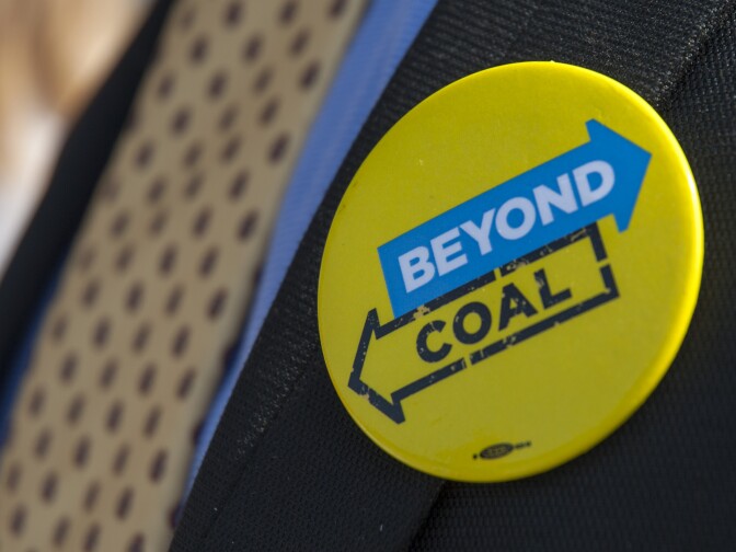 A Beyond Coal button on the lapel of a Sierra Club supporter. Beyond Coal is a promotional campaign organized by the Sierra Club. The campaign's ambitions include the complete elimination of coal as a power source.