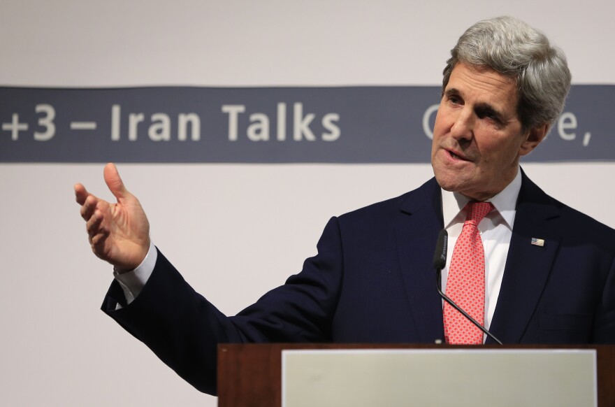 US Secretary of State John Kerry delivers a speech during a press conference at the CICG (Centre International de Conferences Geneve) after talks over Iran's nuclear programme in Geneva on November 24, 2013. World powers on November 24 agreed a landmark deal with Iran halting parts of its nuclear programme in what US President Barack Obama called 'an important first step'. According to details of the accord agreed in Geneva provided by the White House, Iran has committed to halt uranium enrichment above purities of five percent. 